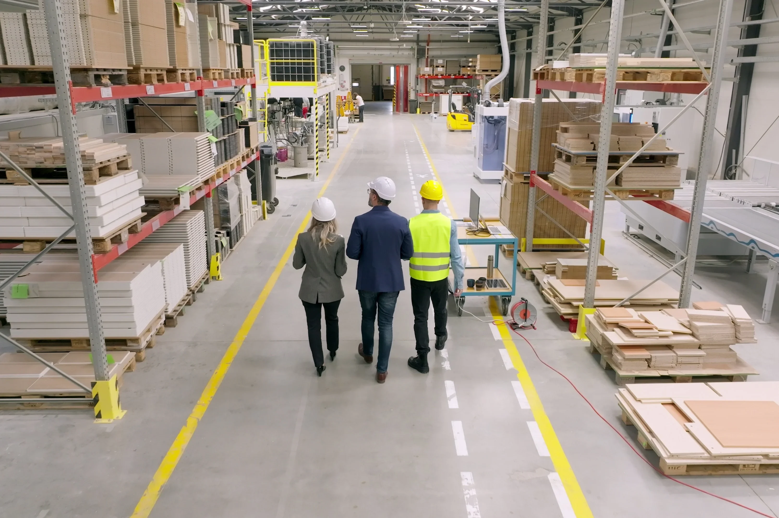 cropped-follow-shot-of-engineers-consulting-with-director-in-modern-industrial-factory-talking-SBI-351571951.webp